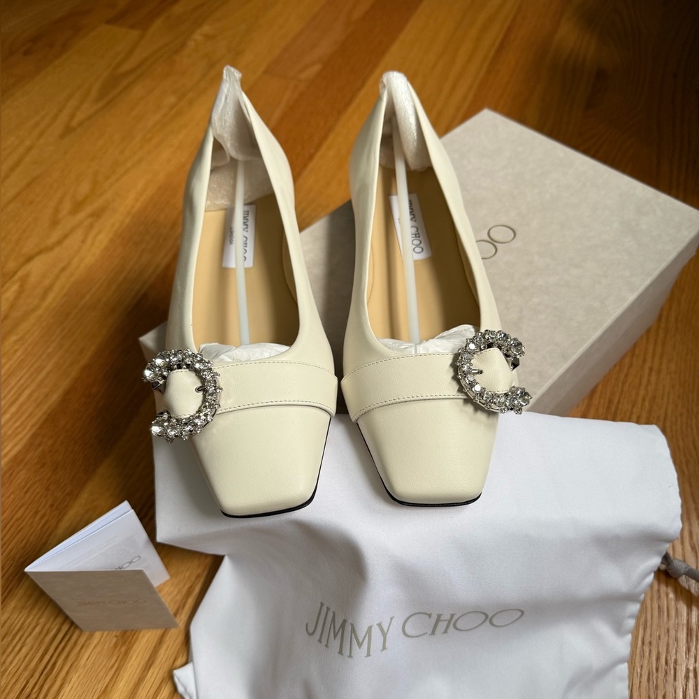 Jimmy Choo Cream flats with C embellishment